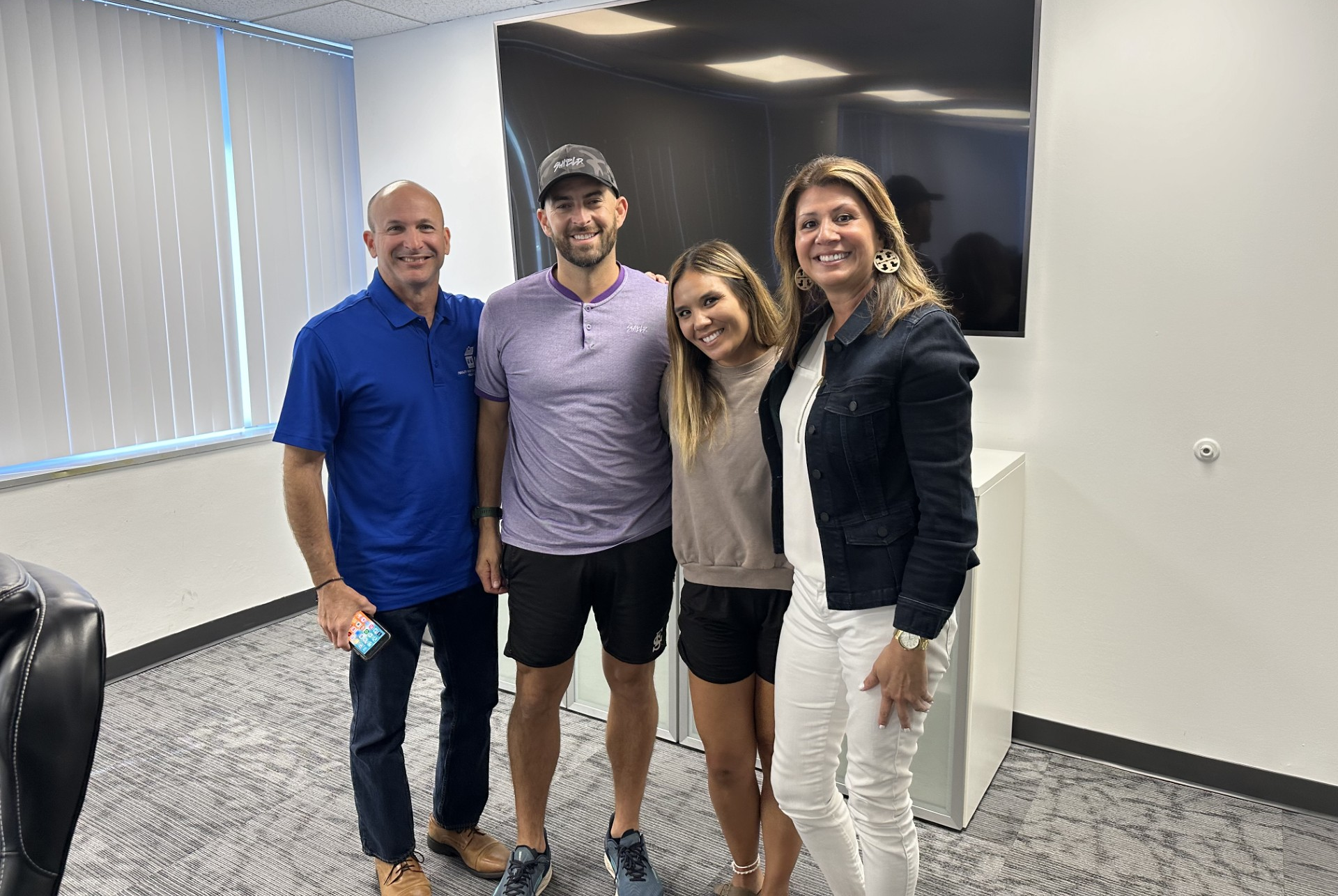 Mike Neill celebrating a home closing with clients in FishHawk, FL